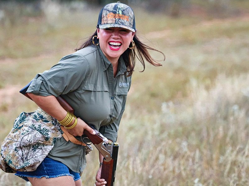 Jessica laughing in the field on a South Texas dove hunt